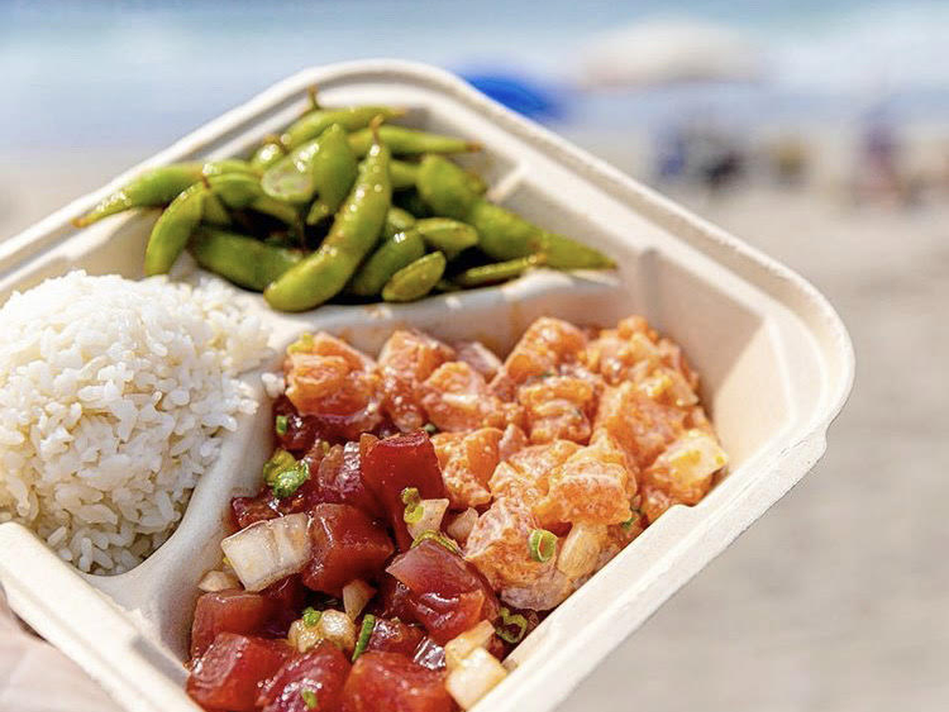 Fresh Hawaiian ahi tuna poke bowl with scallions and sesame seeds